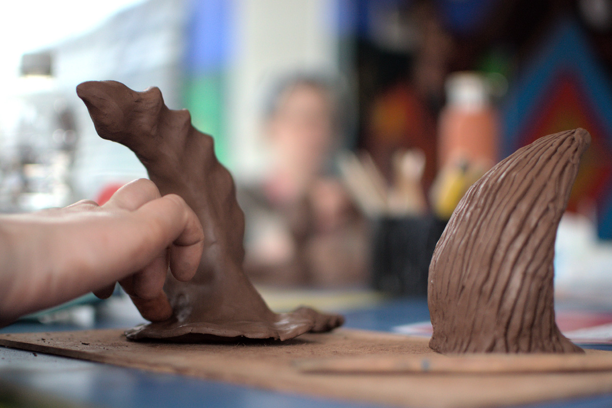 hands working with clay